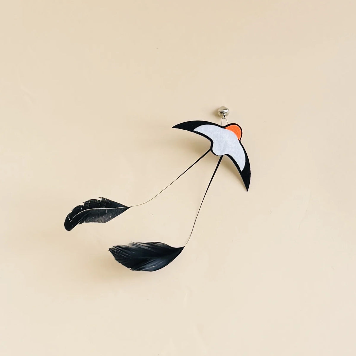Cat pouncing on an insect lure