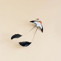 Cat pouncing on an insect lure